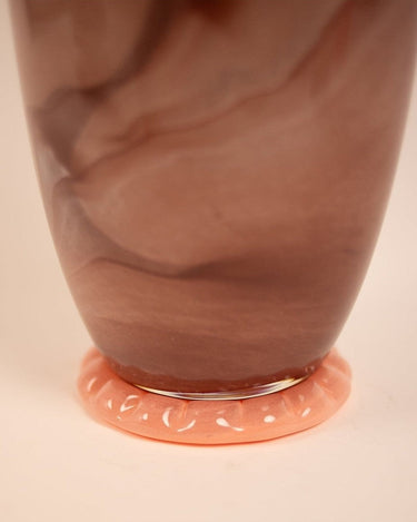 Detail of a brown glass vase with a modern design