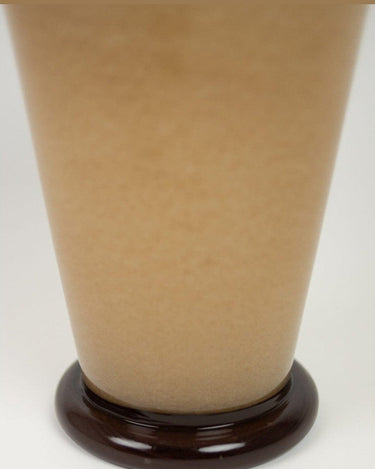 Detail of a beige glass vase with a modern design
