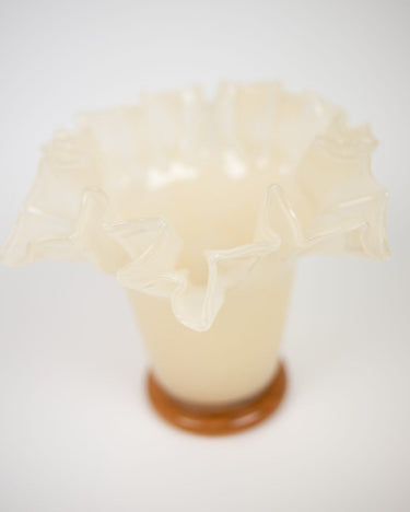 Yellow glass vase by Olsson & Jensen on a shelf