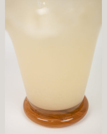 Detail of a yellow glass vase with a modern design
