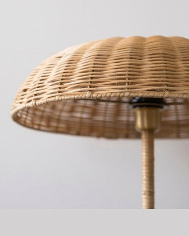 Balzac natural rattan table lamp with an elegant brass base
