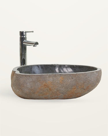Lavabo escultórico de piedra color arena de 59 × 38 cm