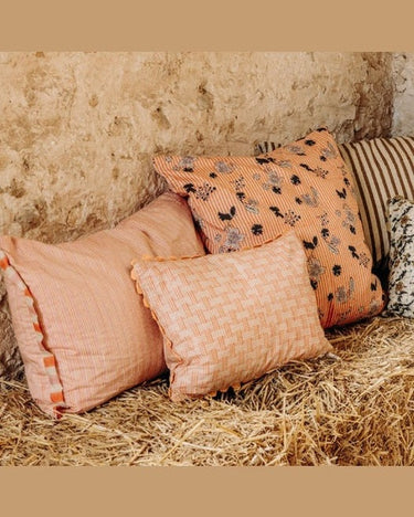 Cotton block print cushion 45 x 45 cm, on a sofa by Le Monde Sauvage