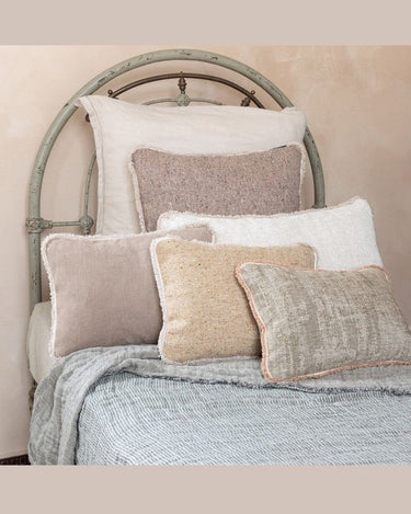 Velvet fringed square cushion 45 x 45 cm, on a sofa by Le Monde Sauvage