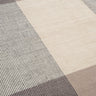 Detalle de alfombra Bologna de lana tono piedra Linie Design