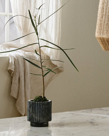 Natural veining detail of LOON green marble indoor planter – Nordal