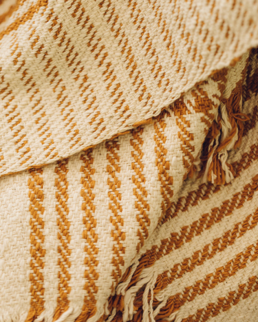 Caravane houndstooth cotton throw on a sofa