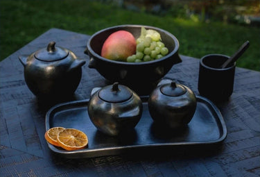 Small black ceramic bowl by Bazar Bizar, side view