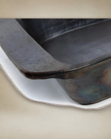 Black ceramic baking tray by Bazar Bizar, detail view