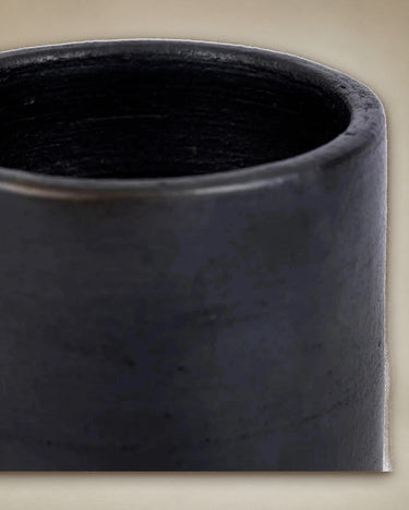 Burnt black ceramic cup by Bazar Bizar on a natural table setting