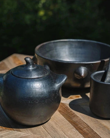 Burnt black ceramic cup by Bazar Bizar as tableware
