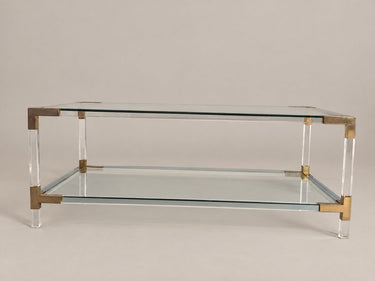 Mesa de centro transparente de dos niveles — perfil largo y patas