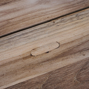 Detail of the finish on the Tine K Home recycled teak outdoor dining table