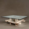 Mesa de mármol travertino y cristal