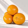 Naranja de cerámica realista artesanal de Ánfora, en una composición de piezas naranjas
