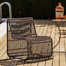 Sillón exterior Dymas de ratán y metal negro