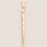 Palillo para el pelo de acetato crema y caramelo de Peignée Paris, sobre fondo topo claro.