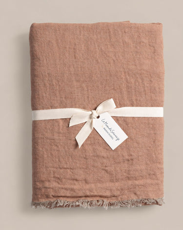 Light pink linen curtain, shown as curtain panels by Le Monde Sauvage