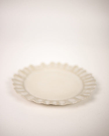 White stoneware dinner plate by Olsson & Jensen on a laid table