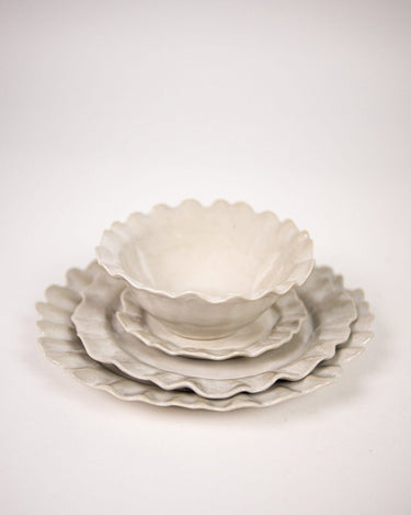 Detail of the rim of the white stoneware dinner plate