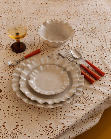 White glazed stoneware dinner plate viewed from above