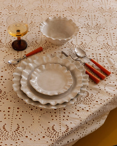 Detail of the rim of the small white stoneware plate