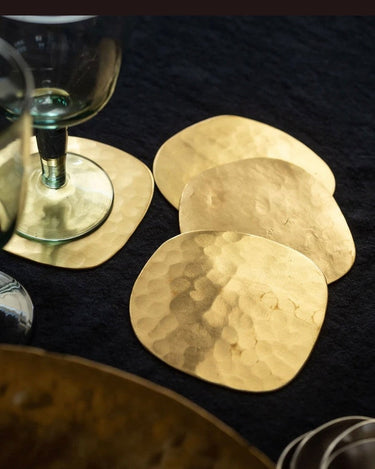 Caravane set of four Ema hammered brass coasters