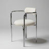 Detalle de silla de acero cromado con tapizado bouclette blanco de Gabrielle Paris