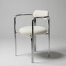 Detalle de silla de acero cromado con tapizado bouclette blanco de Gabrielle Paris