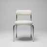 Vista 4 de silla de acero cromado con respaldo calado y asiento bouclé de Gabrielle Paris