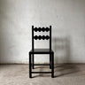 Silla Raaga de madera recuperada con acabado negro