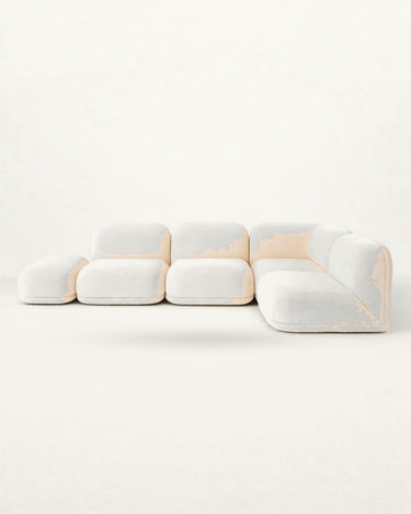 Sofá de Gabrielle Paris, silueta y acabado de sofá esquinero amplio con chaise longue en rizo crema