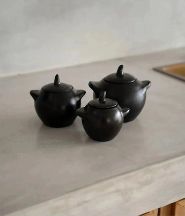 Small black ceramic bowl by Bazar Bizar