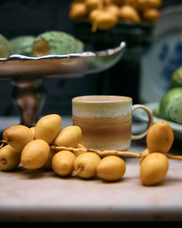 70s-style stoneware coffee mug by HK Living in a kitchen setting