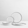 Vajilla de porcelana blanca con borde negro para dos de Broste Copenhagen