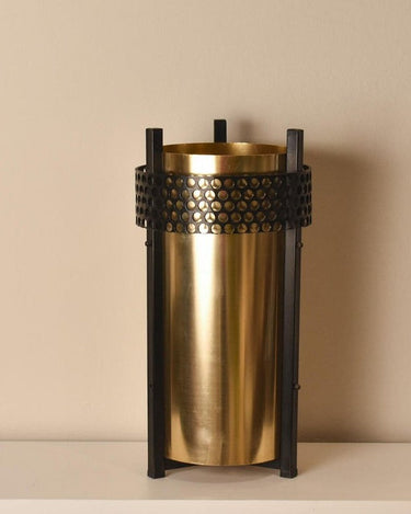 Paragüero vintage de metal dorado y negro