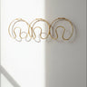 Perchero vintage dorado de pared