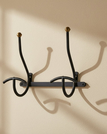 Perchero vintage de pared negro y dorado